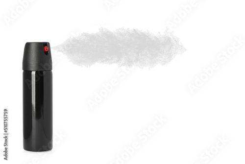 Using of pepper spray on white background photo