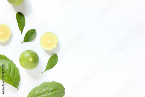 Flat Lay Fresh limes on white background, top view.