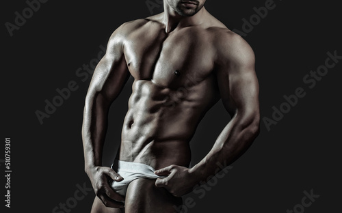 Sexy man with muscular body and bare torso. Muscular shirtless man, attractive guy. Athletic man, fitness model.