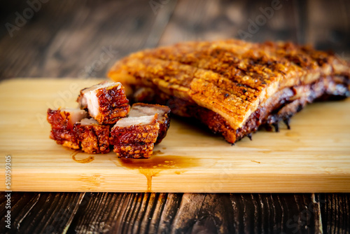 crispy pork belly on woodcutting bord