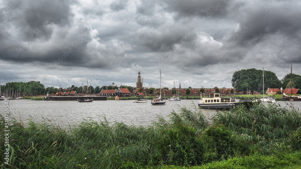 View from the shore to the small Dutch town of Enkhuizen, the Netherlands.