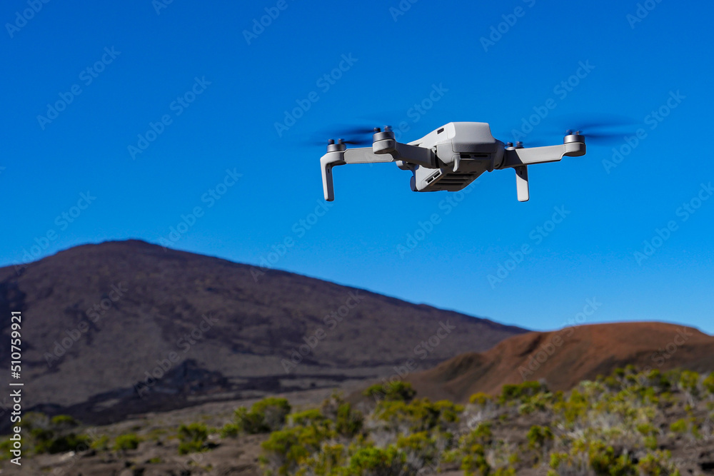 Drone protection flying during the day in volcano mountains, High quality photo Drone protection flying during the day in volcano mountains, High quality photo