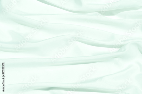 White cloth curve. texture of silk, satin. Shiny fabric background and copy space.