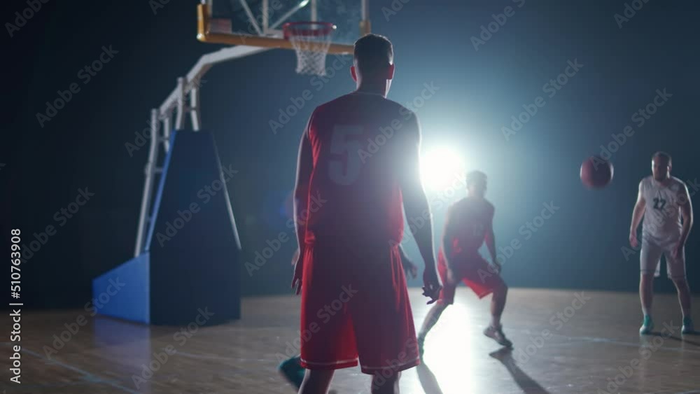International basketball game, the confrontation between two teams, sporty lifestyle, mens active game at night time, cinematic light, 4k slow motion. International basketball game, the confrontation between two teams, sporty lifestyle, mens active game at night time, cinematic light, 4k slow motion.