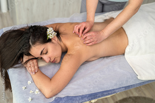 woman receive professional anti-cellulite massage for health back