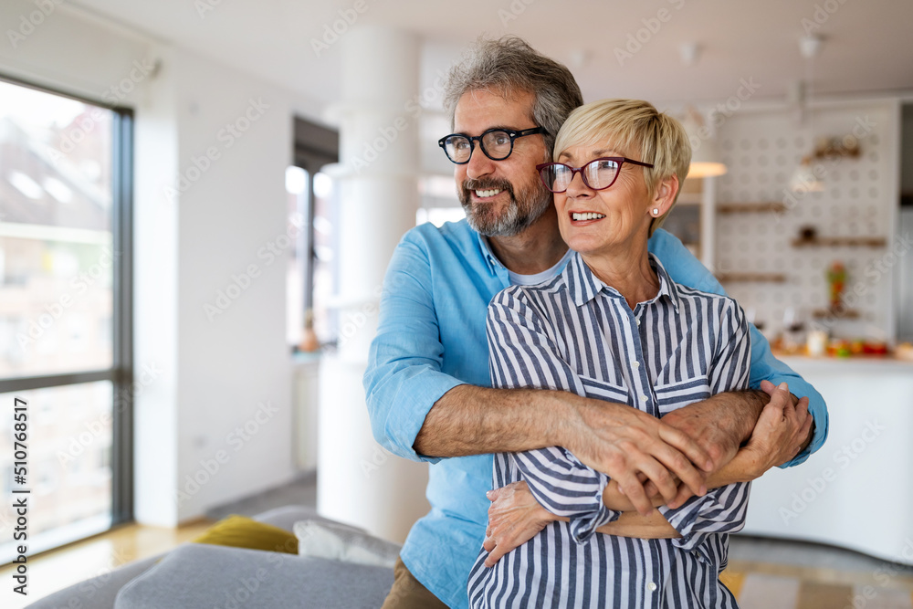 Portrait of happy senior couple in love spending time together at home Portrait of happy senior couple in love spending time together at home