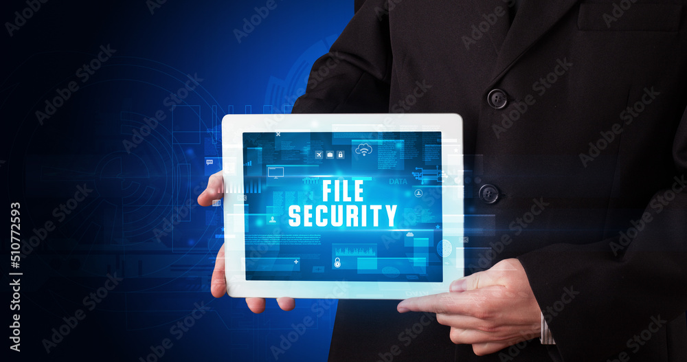 Person holding tablet, security concept Person holding tablet, security concept