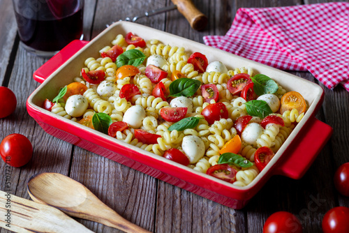 Fusilli pasta with mozzarella, tomatoes and basil. Italian food. Healthy eating. Vegetarian food.