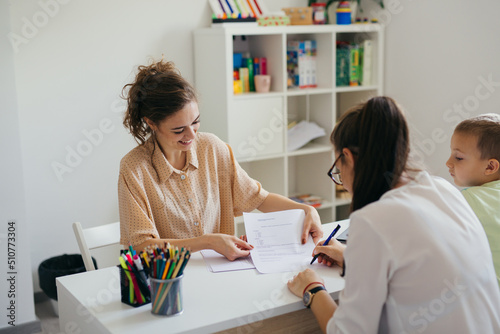 boy having conversation with psychologist for enrollment in school