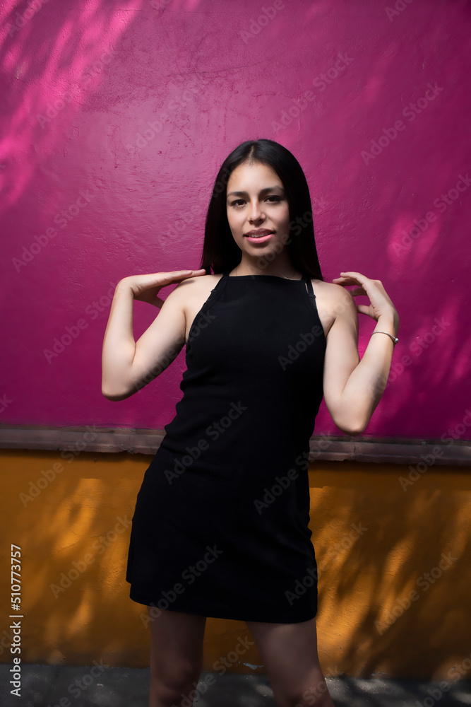 Fototapeta premium Sensual young latin woman posing in mexican town