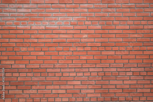 Old red brick wall background, wide angle view . Construction concept