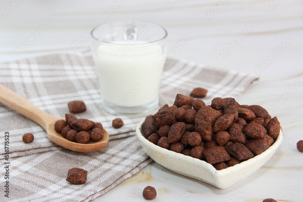 children's chocolate breakfast in the form of pillows and milk in a mug children's chocolate breakfast in the form of pillows and milk in a mug