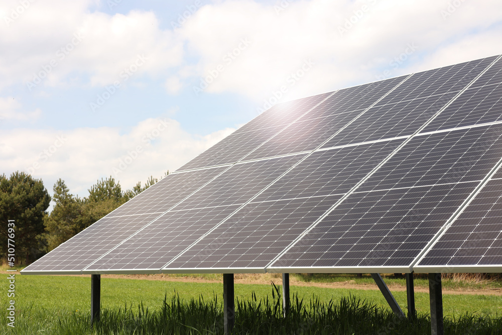 Solar panels in field on sunny day. Alternative energy Solar panels in field on sunny day. Alternative energy