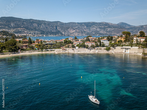 Bay in Saint jean Cap Ferrat near the City of Nice with mountains in the background taken by drone.