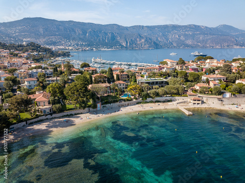 Bay in Saint jean Cap Ferrat near the City of Nice with mountains in the background taken by drone.