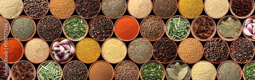 Collection of different aromatic spices and herbs on black background  flat lay. Banner design