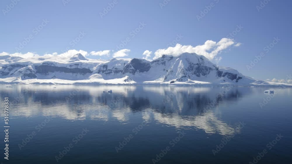 Point Of View Snow Covered Mountains Against Cloudy Sky Seen From Boat Moving In Sea - Patagonia, Argentina Point Of View Snow Covered Mountains Against Cloudy Sky Seen From Boat Moving In Sea - Patagonia, Argentina