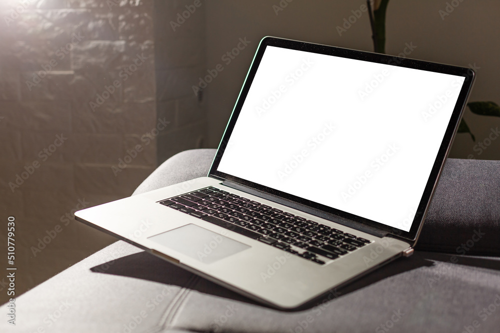 Fototapeta premium Mockup blank screen laptop in living room. Copy space.