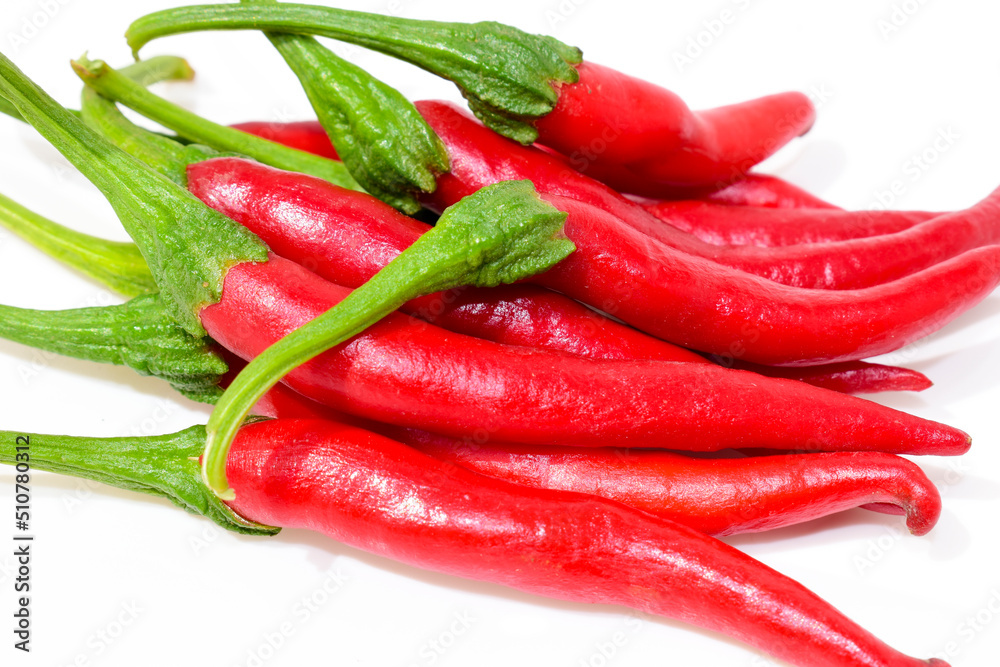 Bunch of fresh red chilli peppers isolated on white background