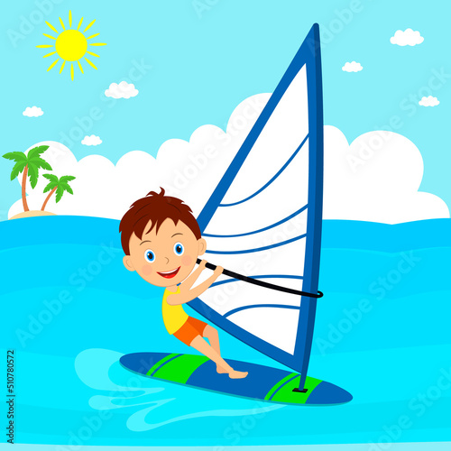 Young boy windsurfing  in the sea