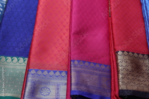 multiple varieties of handwoven silk sarees in multiple colors photo