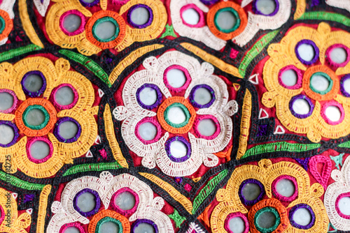 mirrors and shells at market in Rajasthan, India,multicolour ethnic embroidery,Gujarat india embroidery craft close up view,pakistan embroidery,abhala Bharat or Shisha embroidery