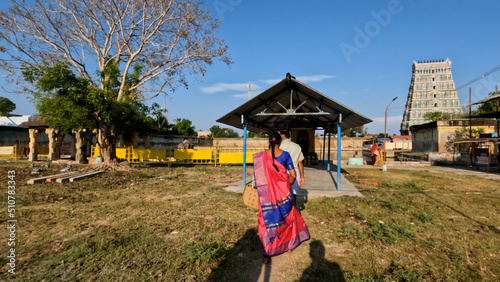 Uthirakosamangai Temple, Ramanathapuram, Tamil Nadu ; Women in traditional saree walking towards a temple