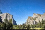 scenic view in Yosemite valley to mountains of el capitan and cathedral rock