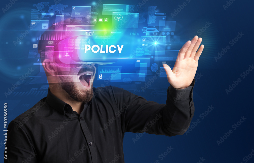Businessman looking through Virtual Reality glasses Businessman looking through Virtual Reality glasses