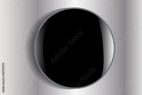 round convex glossy object. the button, the magnet is black. on a gray background.