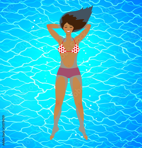 Happy young woman floating on blue water surface