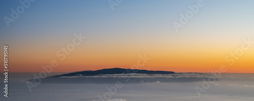 View of Island La Gomera above clouds from Teide National Park road. Tenerife Island.