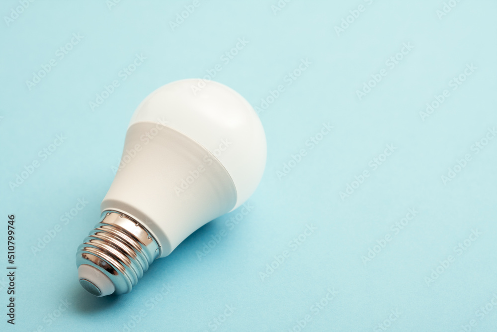 White light bulb on blue background with free copy paste space. White light bulb on blue background with free copy paste space.