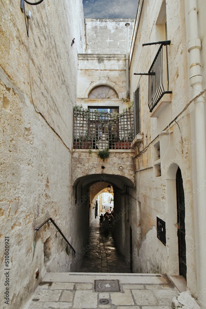 A small street between the old houses of Polignano a Mare. medieval town in the Puglia region in Italy.