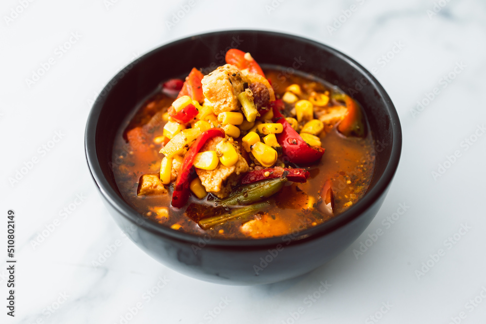 healthy plant-based food, vegan bell pepper corn and tofu soup with spicy broth healthy plant-based food, vegan bell pepper corn and tofu soup with spicy broth