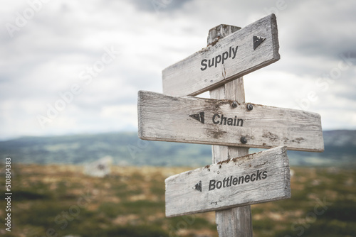 Obraz na plátně supply chain bottlenecks text quote on wooden signpost outdoors in nature