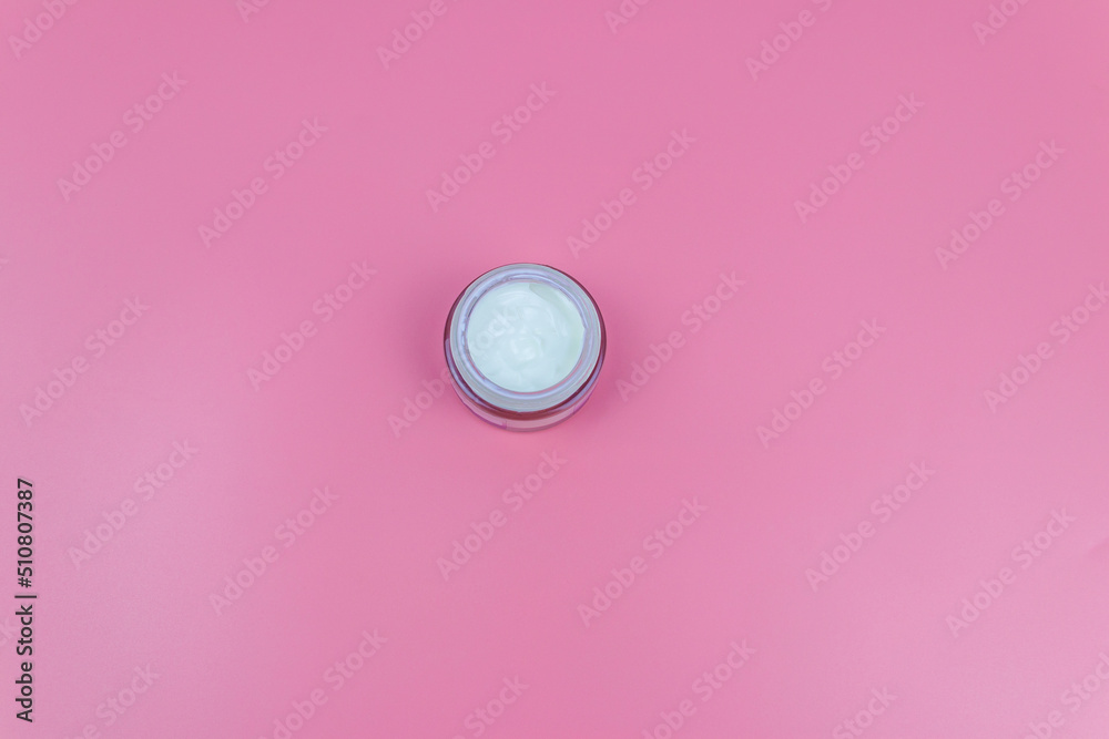 Face cream on a pastel pink background. Top view Face cream on a pastel pink background. Top view
