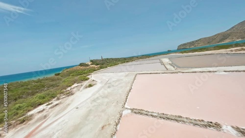 Salt Flats And Small Lighthouse Tower On The Isla Cabra Near Montecristi In The Dominican Republic. FPV drone shot photo