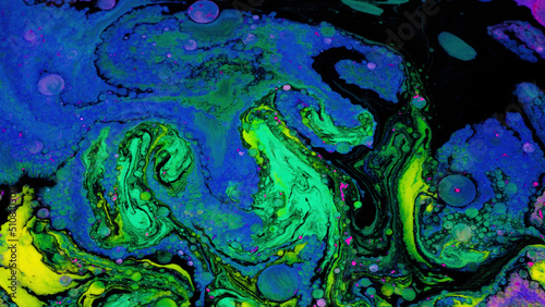 Bright fluid art with acidic colors and bubbles. Stock footage. Liquid mixing patterns of bright colors with bubbles on flat surface. Acidic colorful patterns