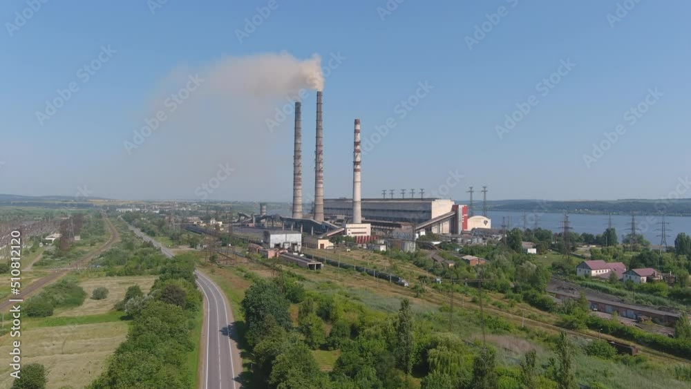 Gas turbine converts natural gas, other liquid fuels to mechanical energy. Aerial view of chimneys of power plant, an industrial district. Modern large thermal power plant. Working chp. Gas turbine converts natural gas, other liquid fuels to mechanical energy. Aerial view of chimneys of power plant, an industrial district. Modern large thermal power plant. Working chp.