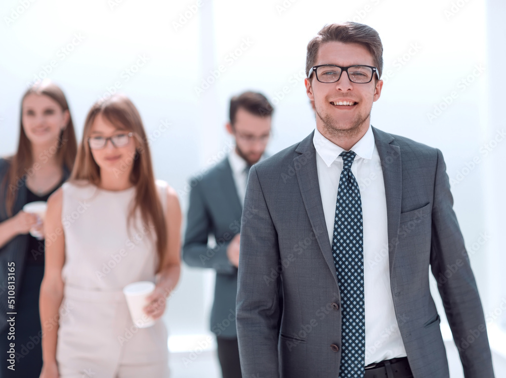 confident young businessman in the background of the office confident young businessman in the background of the office