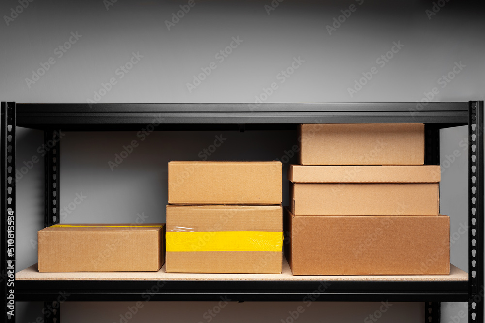 Rack shelves with paper boxes in warehouse. Rack shelves with paper boxes in warehouse.