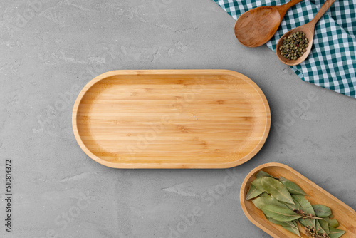 Empty wooden plate on kitchen table, top view