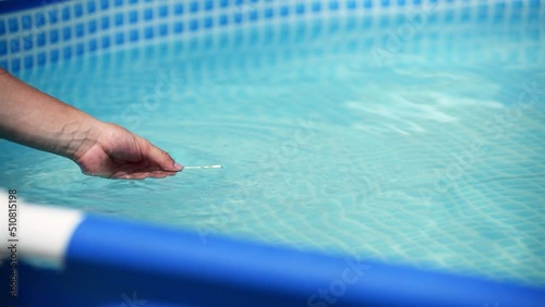 Strip for testing water for chlorine, ph in the home swimming pool. Home pool care