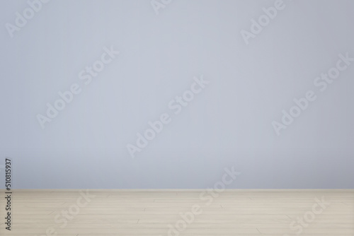 Blue wall and wooden floor in empty room for copy or product presentation