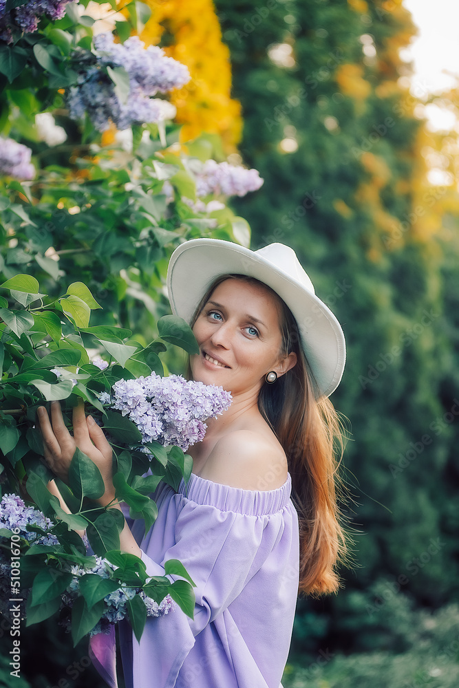 Girl in the garden with a hat, evening