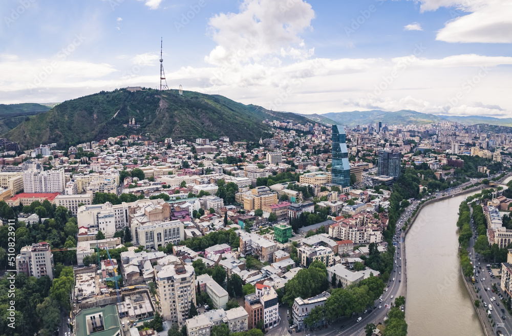 Fototapeta premium scenic drone shot of Tbilisi center and Mtatsminda TV mast, Georgia, Europe. High quality photo