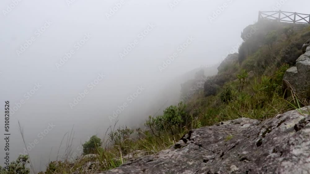 white mist moving fast towards mountain top from flat angle white mist moving fast towards mountain top from flat angle