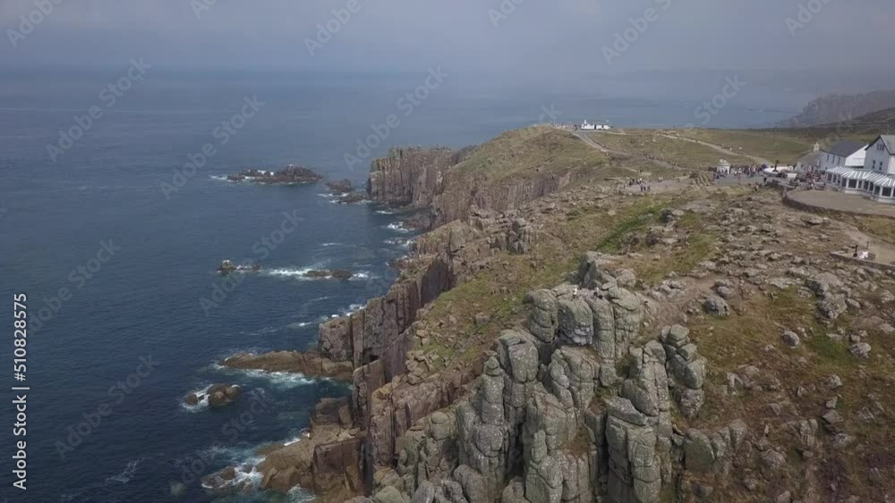 Aerial perspective tilt of rugged seaside cliffs at Lands End, England Aerial perspective tilt of rugged seaside cliffs at Lands End, England
