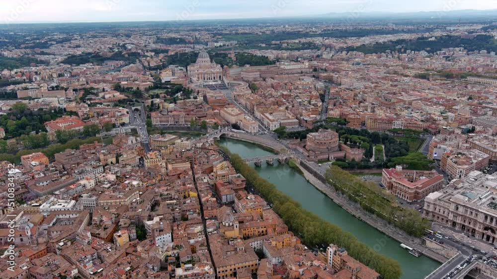 St. Peter's Basilica in Vatican City and Rome city aerial skyline in Italy feat. beautiful old cityscape of European Roma drone point of view with famous historical landmarks along River Tiber 